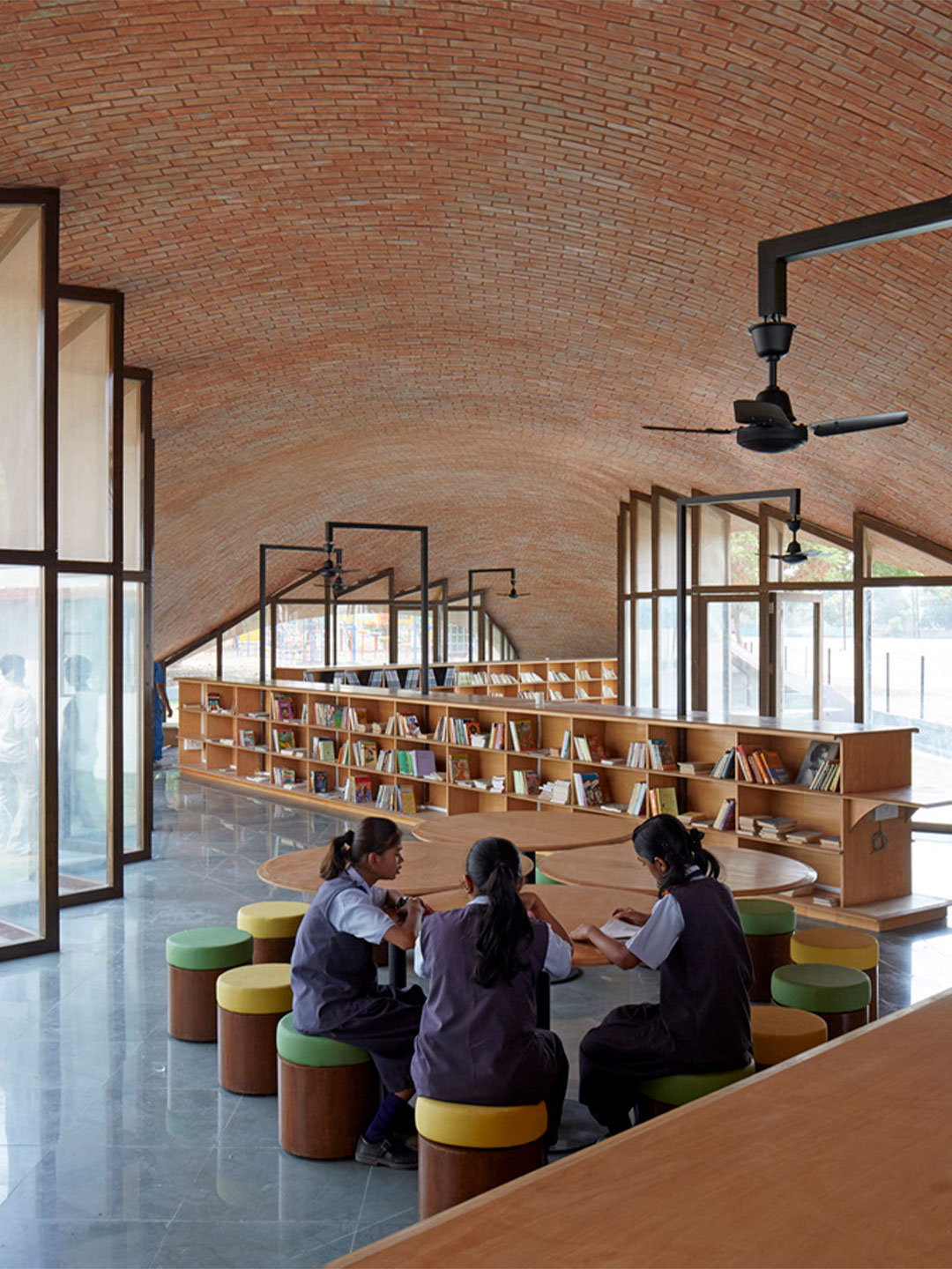 Designed by Sameep Padora & Associates, the Maya Somaiya Library in India rests at the intersection of students' daily routine. 