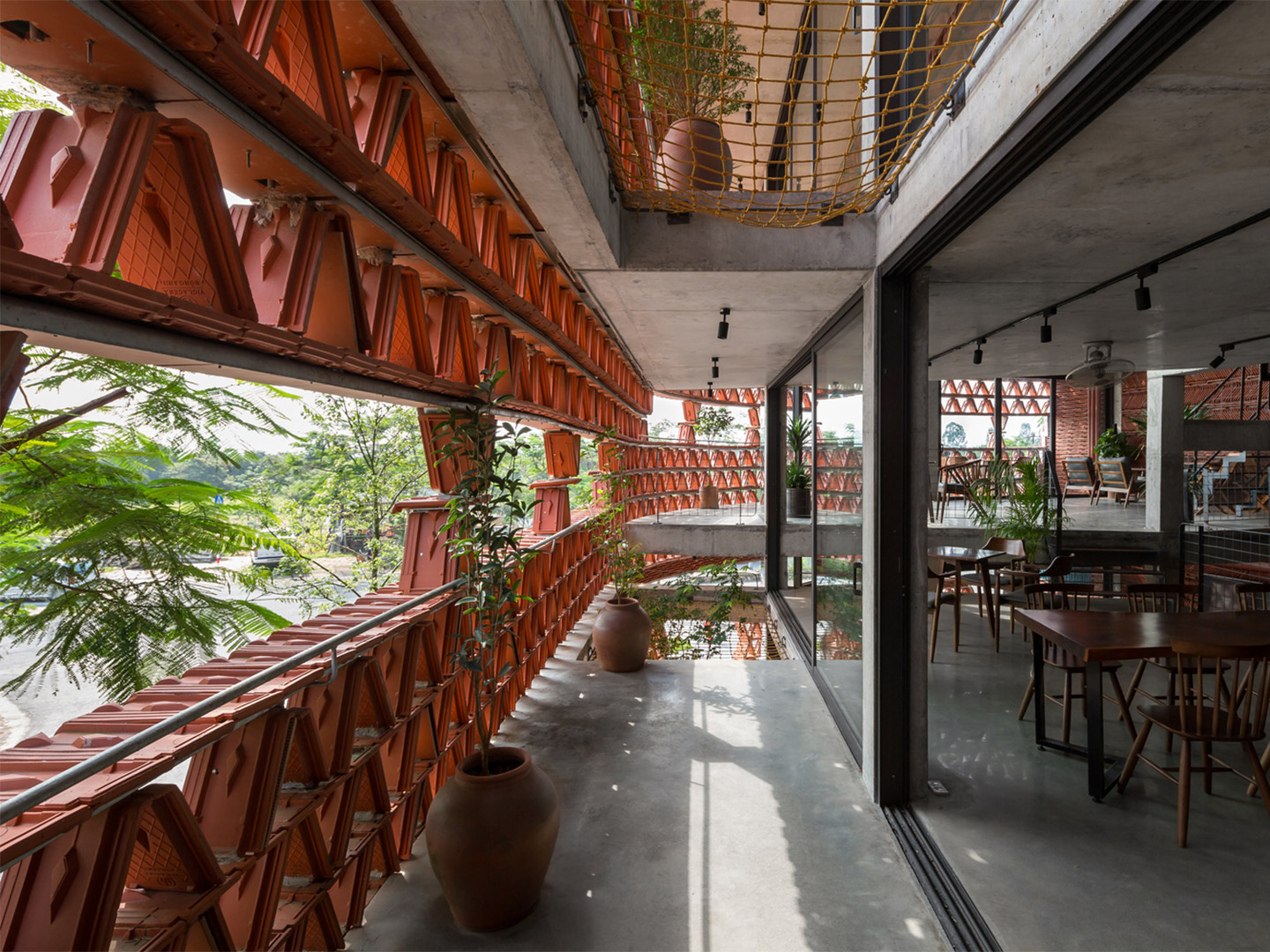 H&P Architects in Vietnam, reclaimed roof tiles as facade